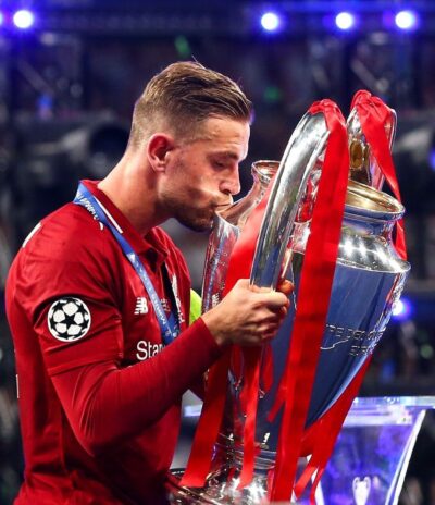 Jordan Henderson celebrating his Champions League Trophy win while he was at Liverpool.